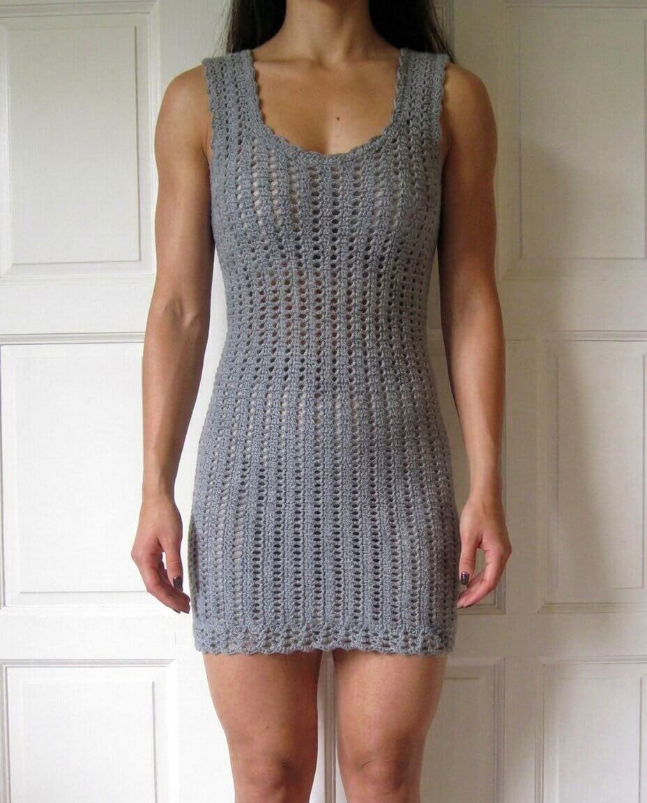 Soft gray crochet bodycon mini dress with a scoop neckline thick straps and an allover vertical chain space openwork stitch pattern