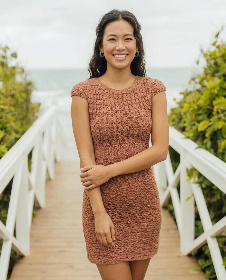 Terracotta crochet mini dress with cap sleeves a fitted bodice and an allover delicate openwork lace stitch pattern