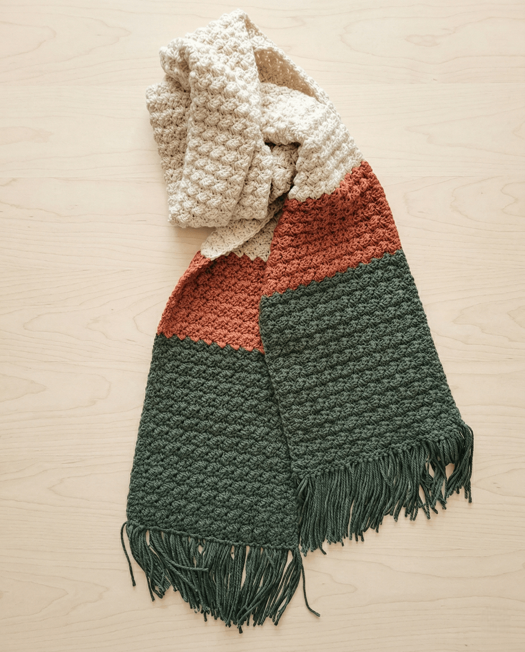 Color block super scarf in cream, rust, and forest green with fringe