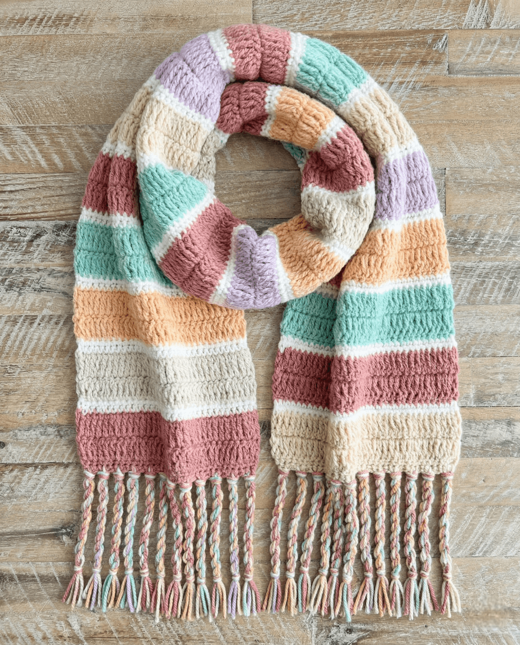 Colorful striped crochet blanket scarf with multicolor fringe
