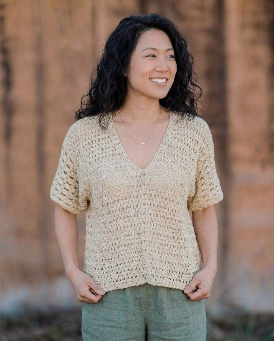 Crochet V-neck summer top in soft beige with an openwork lace pattern, short drop sleeves, and a relaxed boxy silhouette